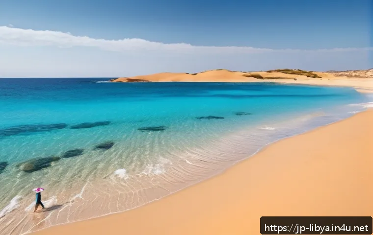 리비아의 해변과 휴양지 추천 - A serene Mediterranean beach scene at Sabra Beach, Libya, featuring crystal-clear turquoise waters g...